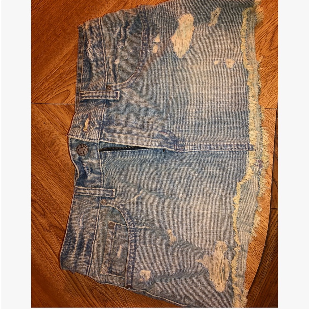 Ripped denim mini skirt